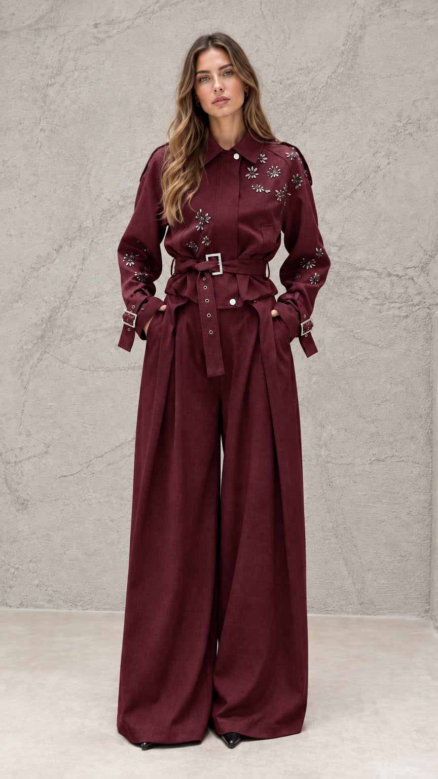 Full front view of model wearing burgundy embellished wide-leg jumpsuit