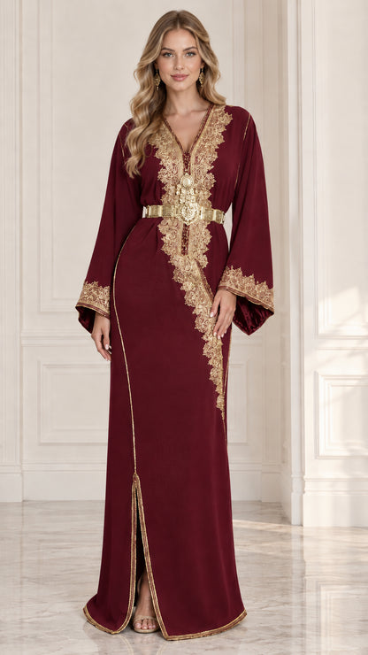 Front view of model wearing burgundy Moroccan kaftan dress with gold embroidery and belt