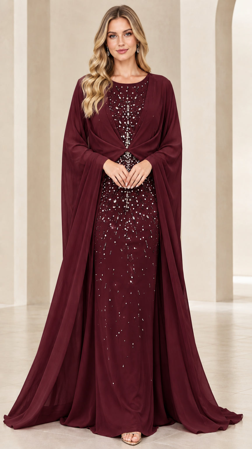 Model wearing burgundy wine embellished chiffon cape evening dress