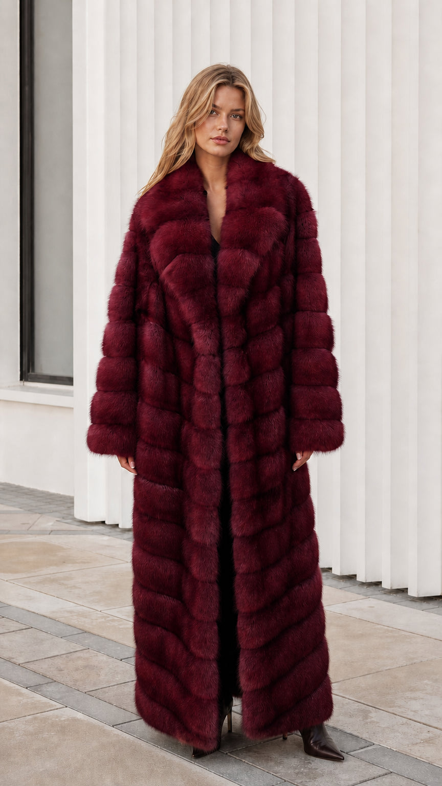 Front view of model wearing rich burgundy wine red full-length faux fur maxi coat