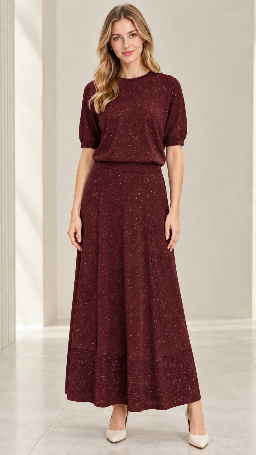 Model wearing burgundy wine red two-piece shimmer knit skirt set