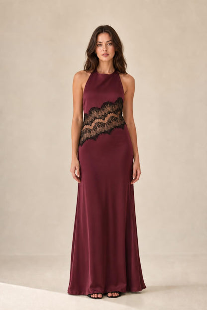 Front view of burgundy halter neck maxi dress with lace insert