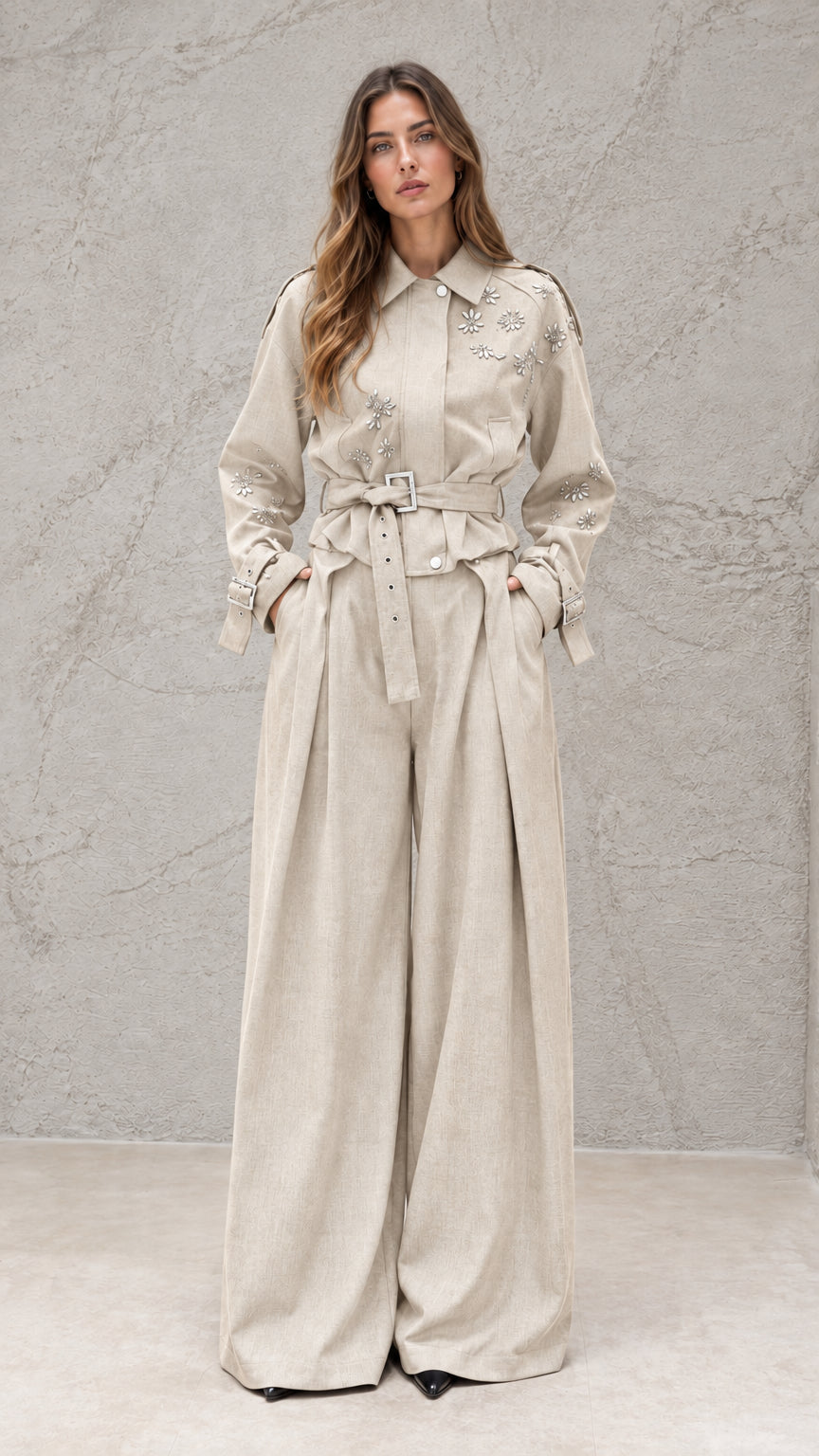 Full front view of model wearing beige embellished wide-leg jumpsuit