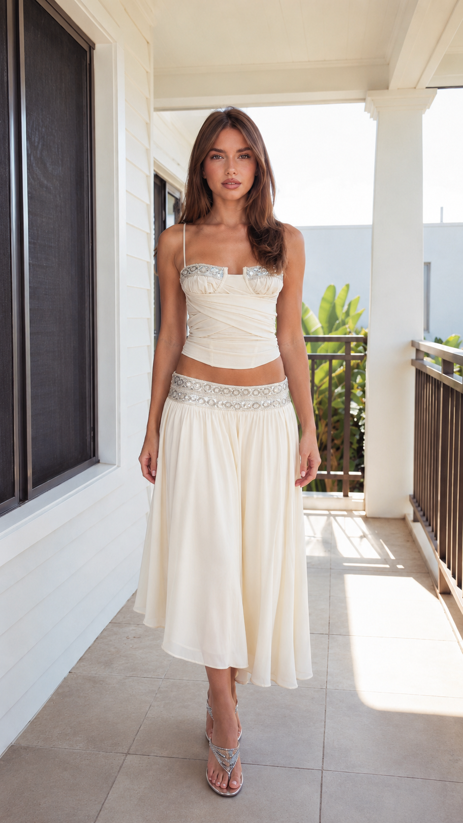 Front view of ivory embellished cami top and midi skirt set