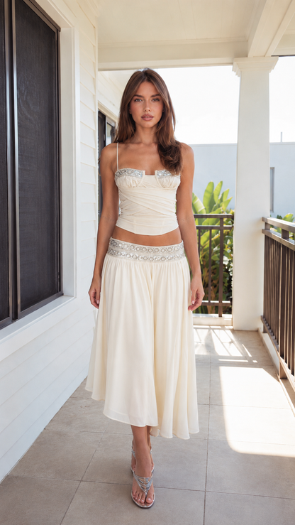 Front view of ivory embellished cami top and midi skirt set