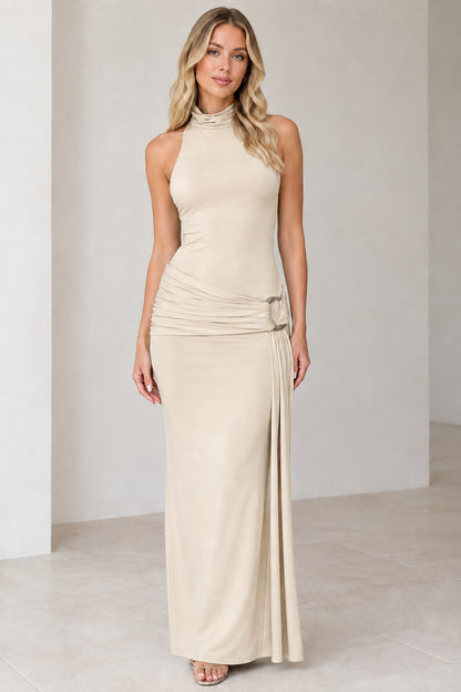 Model wearing beige champagne high-neck sleeveless ruched maxi dress