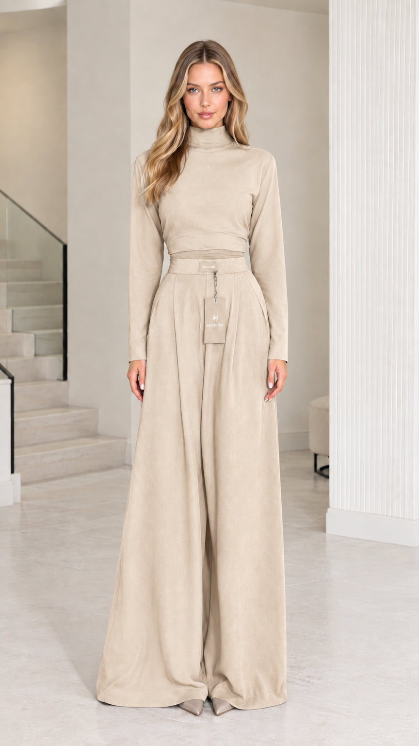 Front view of model wearing beige cream mock neck long sleeve top and palazzo pants set