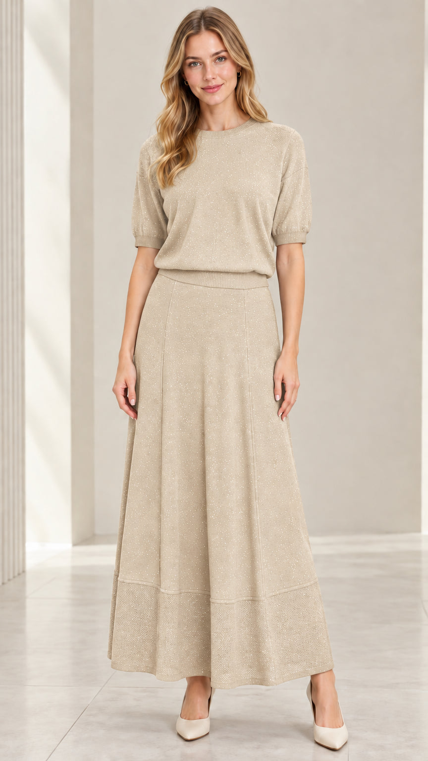 Model wearing champagne beige metallic sparkle knit top and maxi skirt set