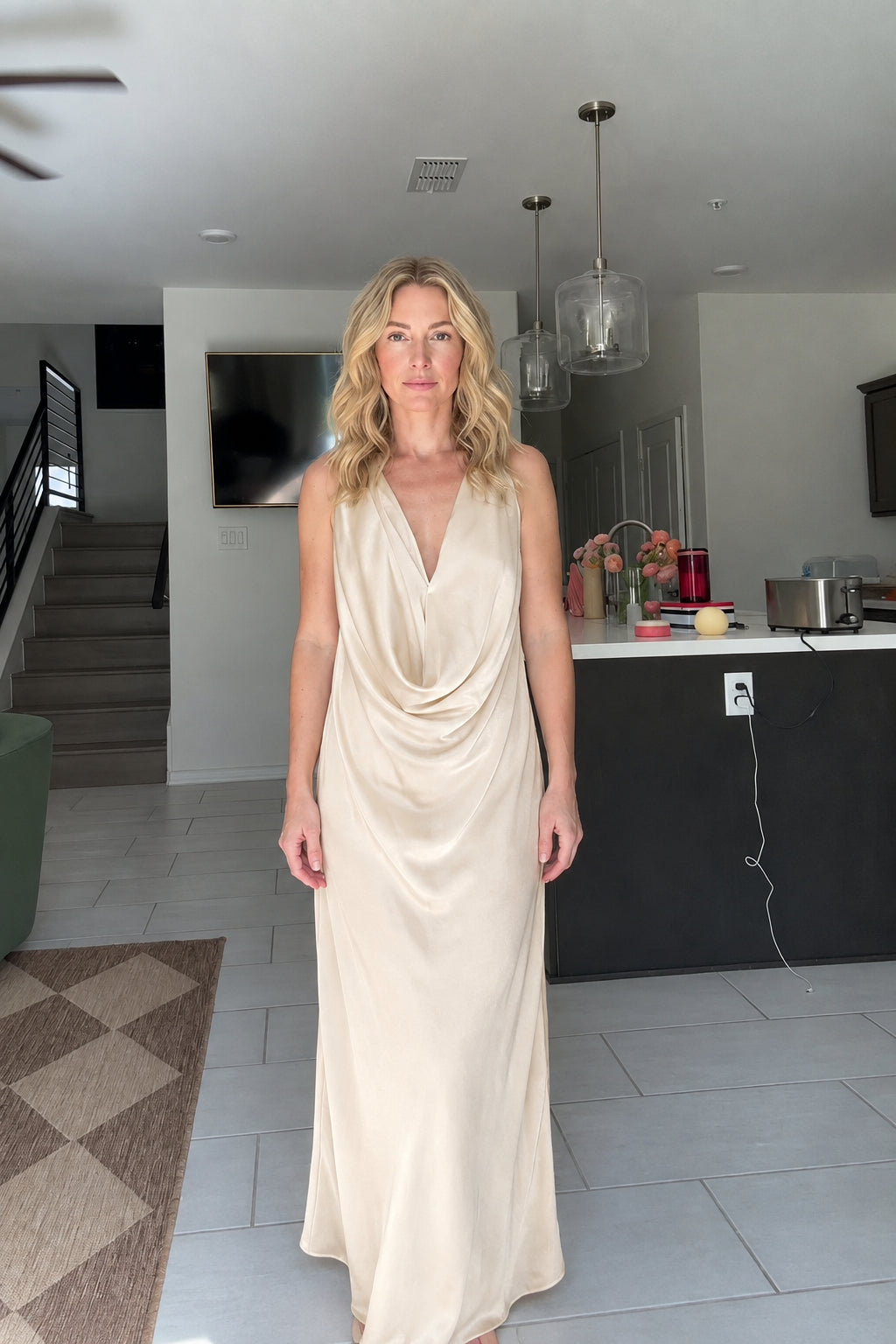 Front view of woman wearing Champagne beige draped cowl neck maxi dress