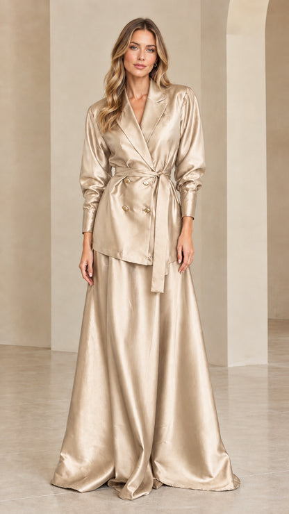 Woman wearing champagne gold satin double-breasted blazer and maxi skirt set