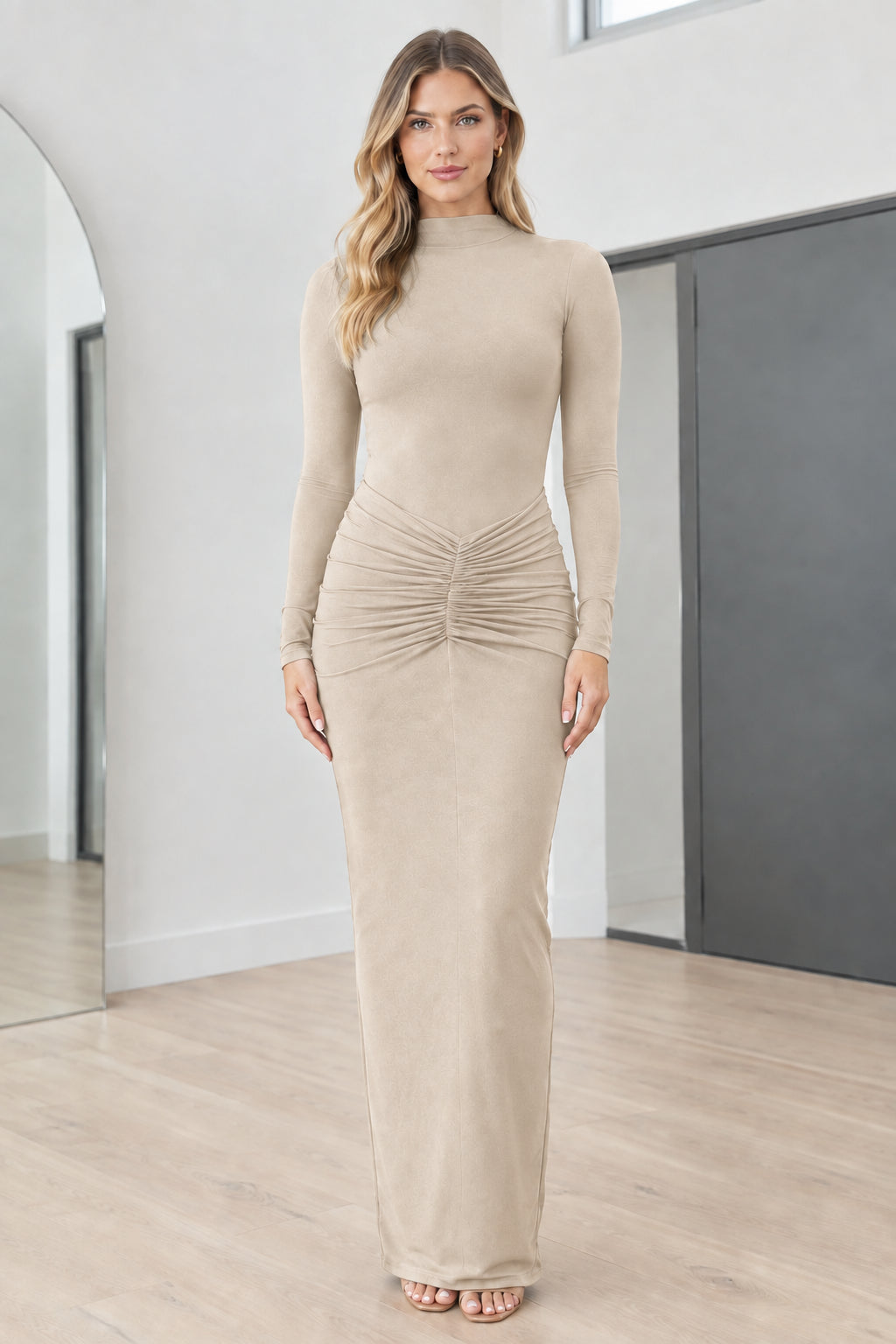 Full front view of model wearing Beige mock neck long sleeve ruched maxi dress