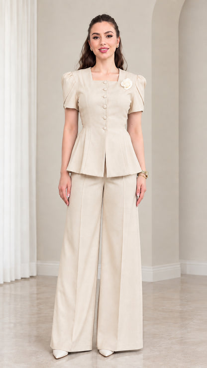 Model wearing Beige short sleeve peplum top and wide leg pants set