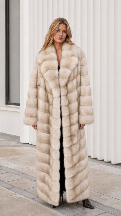 Front view of model wearing cream off-white full-length faux fur maxi coat