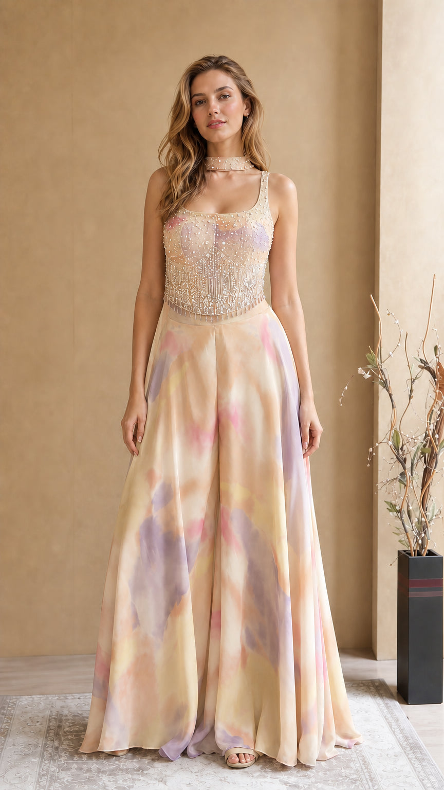 Model wearing Champagne Multi pastel tie-dye embellished formal jumpsuit