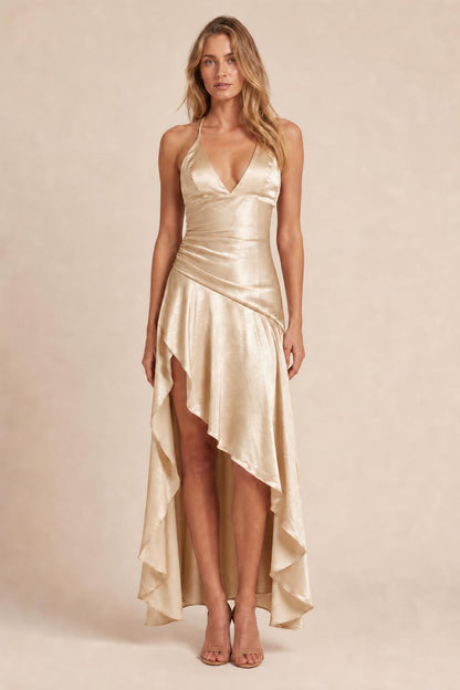 Model wearing champagne satin halter high-low maxi dress