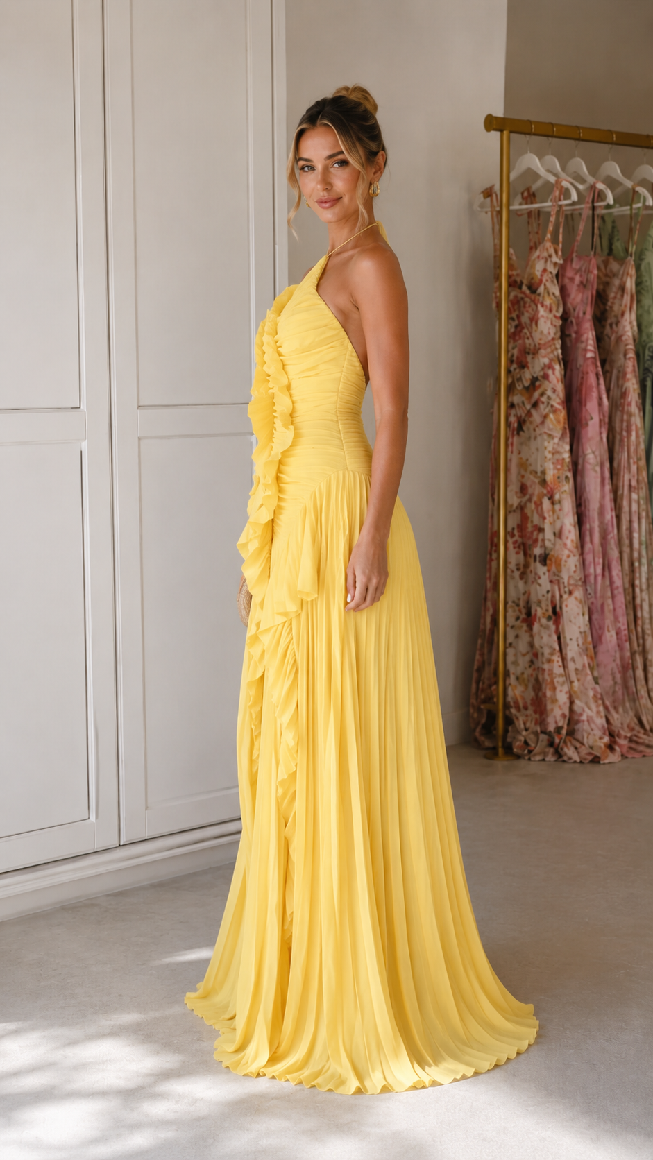 Side view of butter yellow pleated ruffle maxi gown